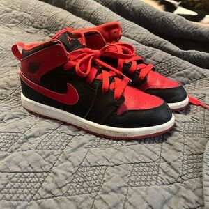 Red and black Nike Air Jordan’s